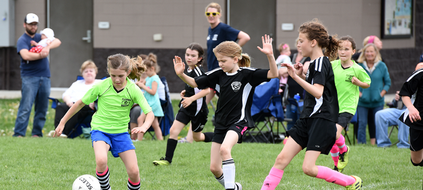 Children playing youth soccer