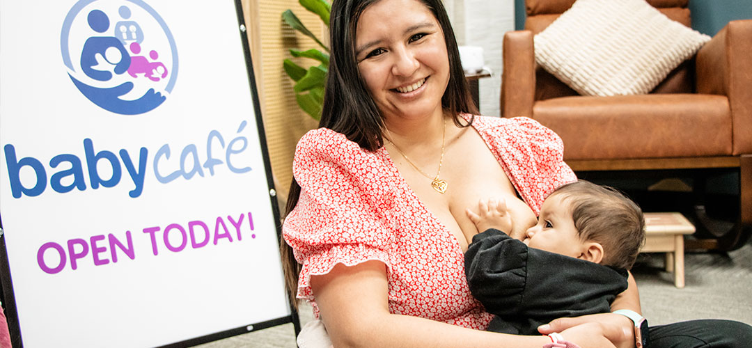 Mother breastfeeding baby at Baby Café, open today.