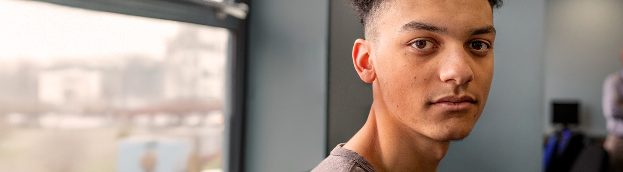 A portrait of a young man inside